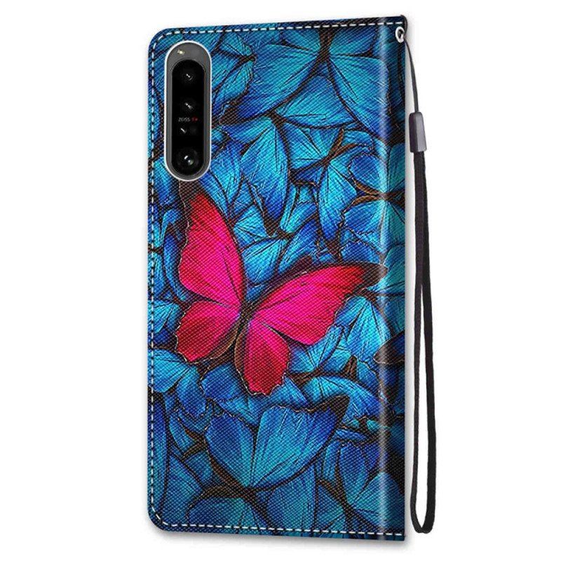 Etui Folio do Sony Xperia 1 IV Czerwony Motyl Niebieskim Tle