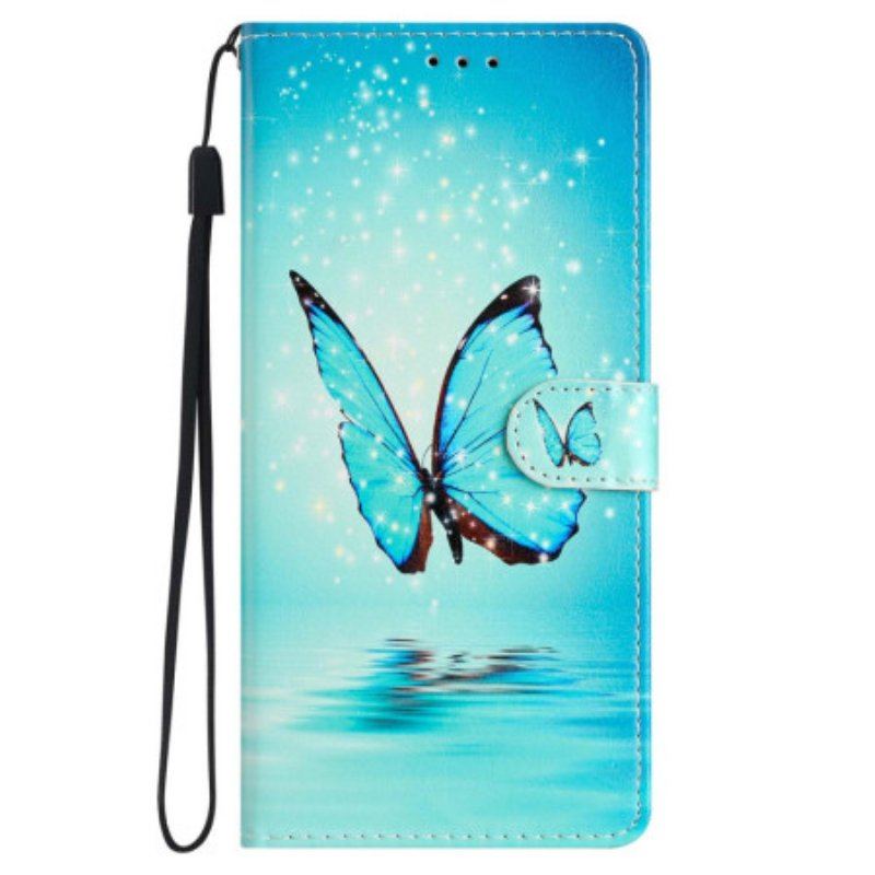 Etui Folio do iPhone 15 z Łańcuch Niebieski Motyl W Locie Z Paskiem